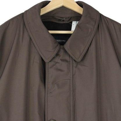 Burberry brown quilted coat featuring iconic Nova Check pattern and removable wool lining.