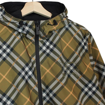 Burberry reversible nylon jacket in brown and black Nova Check pattern with logo.