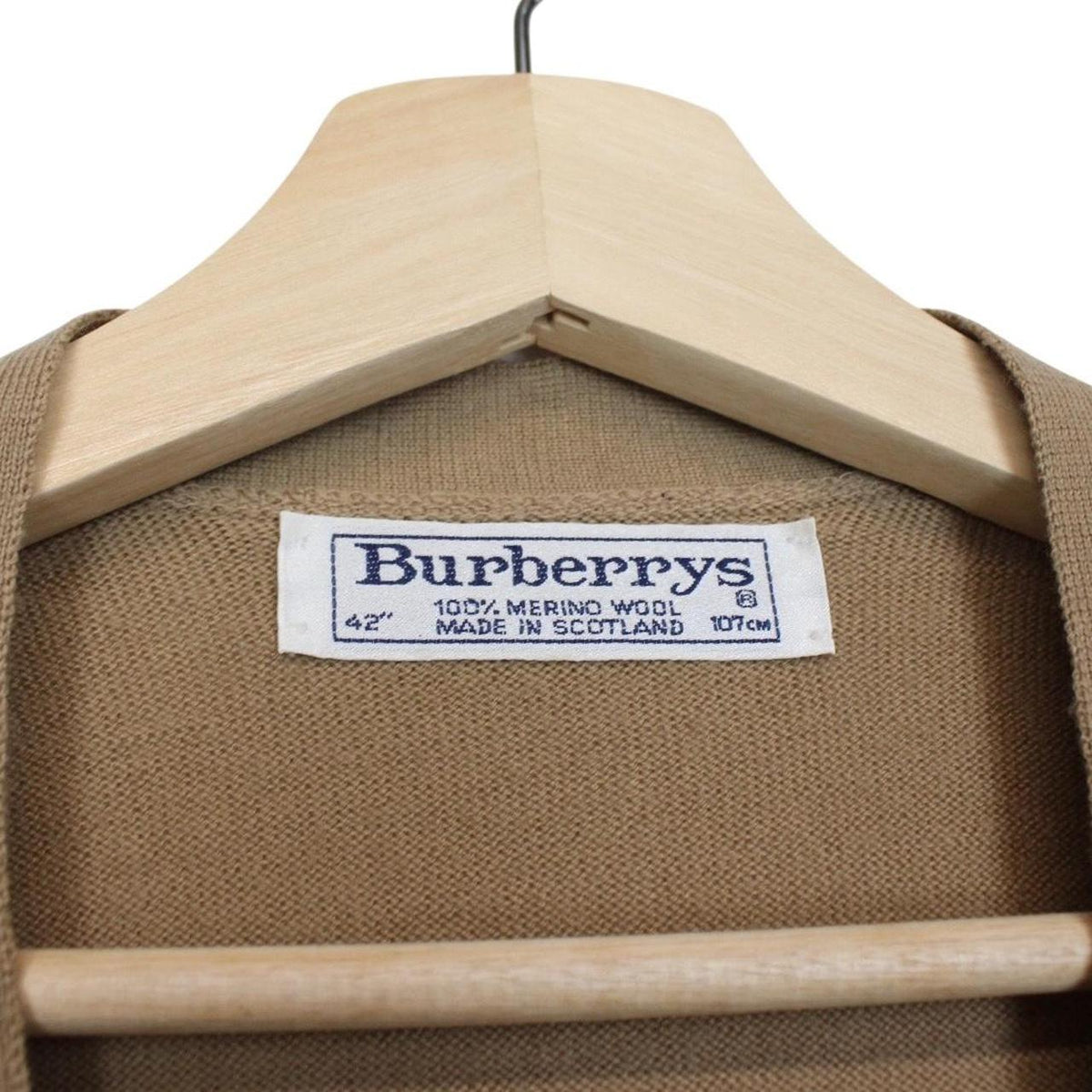 Burberry beige knit sweater vest with Nova Check pattern and merino wool material.