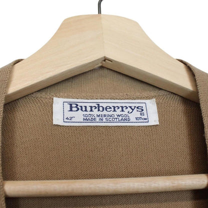 Burberry beige knit sweater vest with Nova Check pattern and merino wool material.