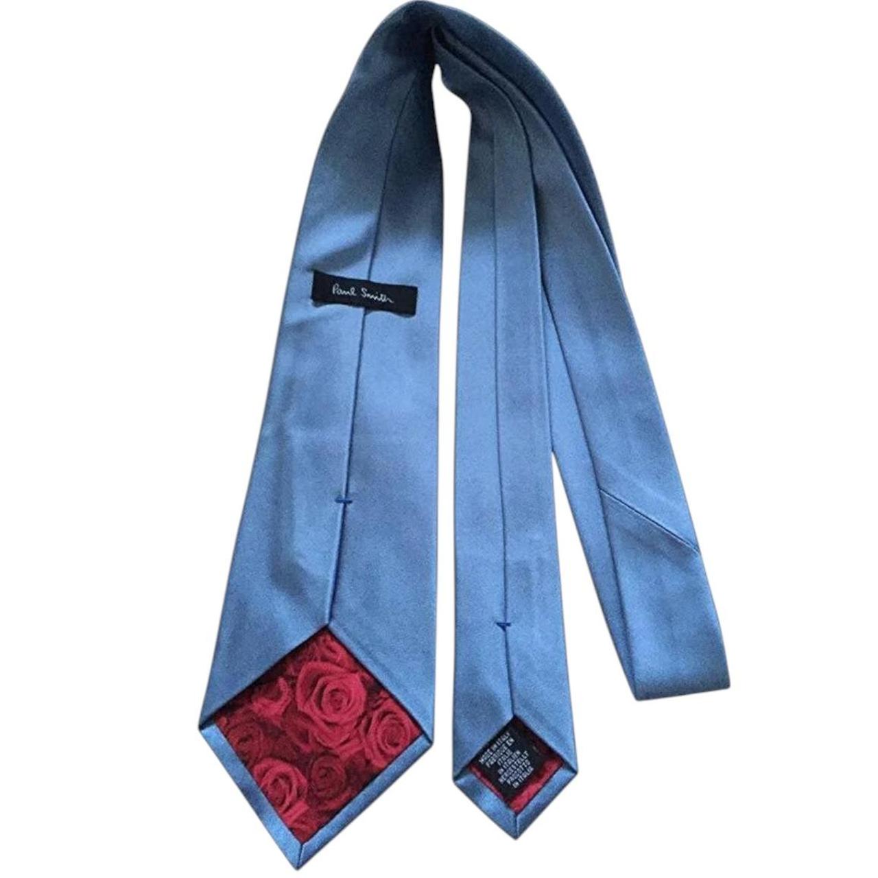 Paul Smith blue silk tie with signature logo and smooth finish.
