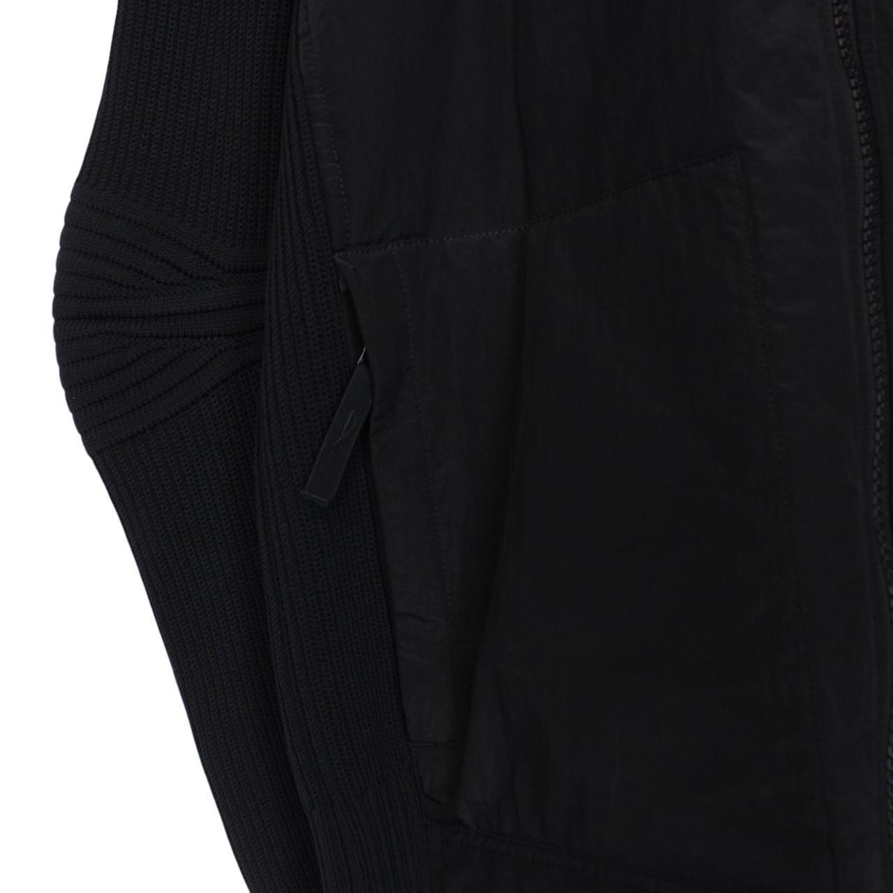 Stone Island black jacket with special process badge and full zip design.