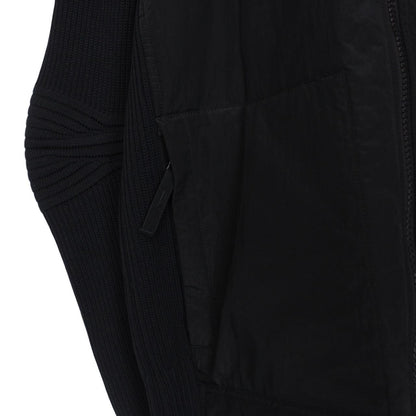 Stone Island black jacket with special process badge and full zip design.
