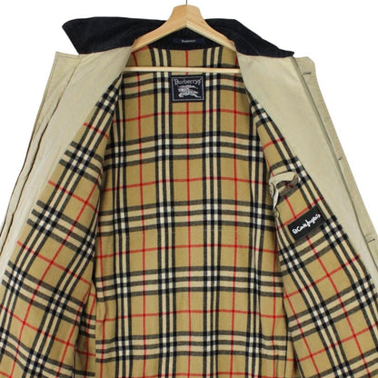 Burberry beige wool coat with Nova Check lining and logo detailing.