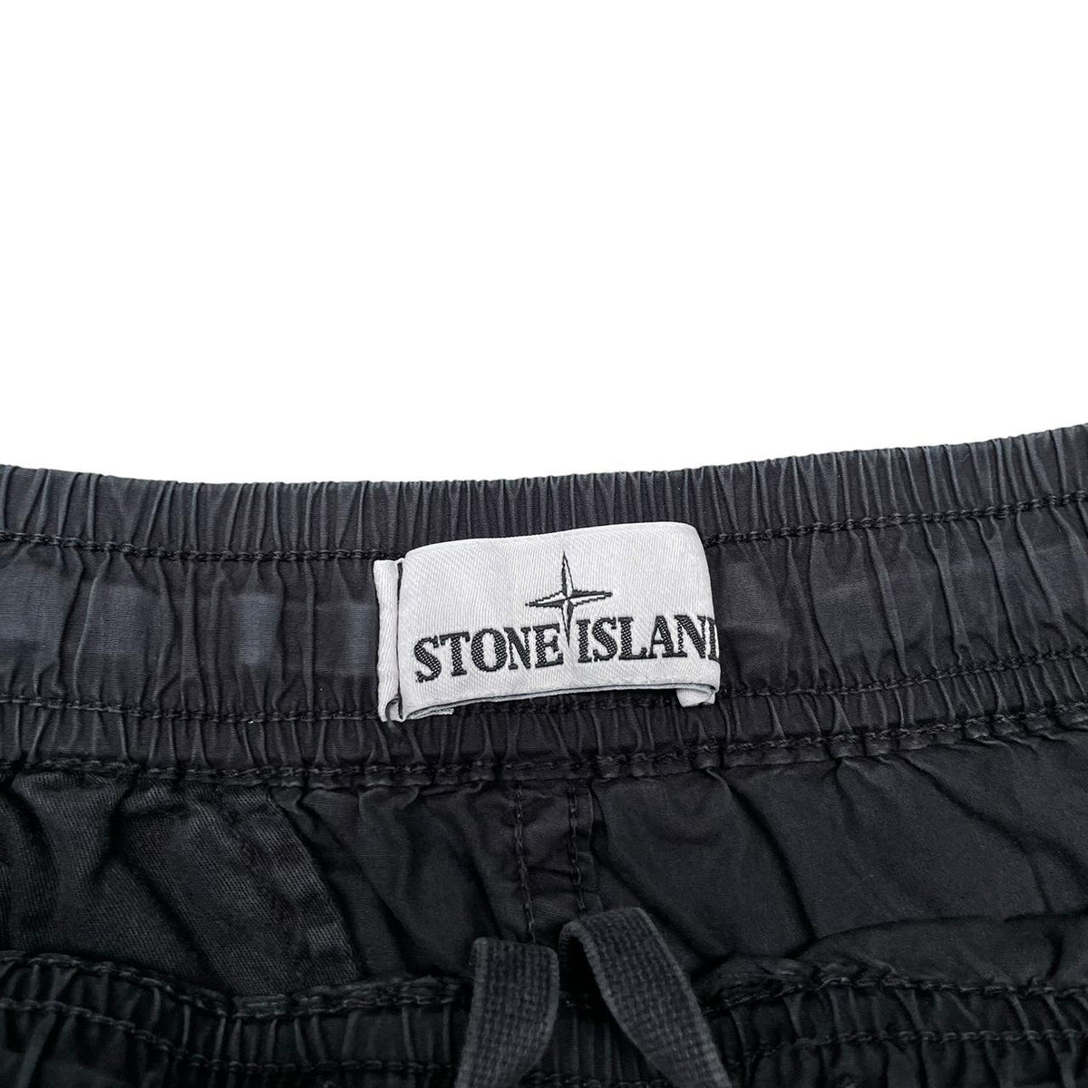 Stone Island black cargo shorts with logo patch and cotton material, size medium.