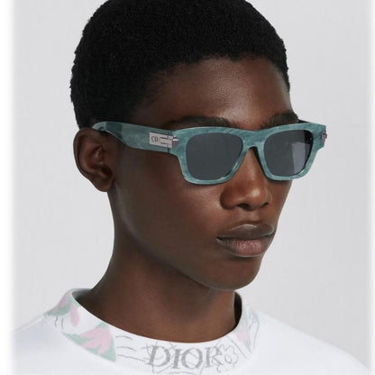Dior sunglasses black and turquoise marble design with Wayfarer shape and logo.