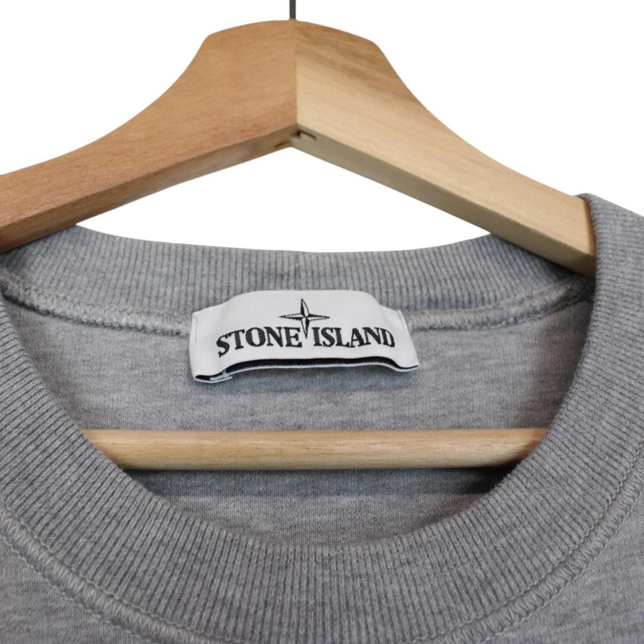 Stone Island grey cotton sweatshirt with logo patch and faint mark on sleeve.