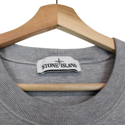 Stone Island grey cotton sweatshirt with logo patch and faint mark on sleeve.