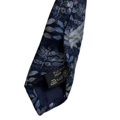 Ermenegildo Zegna blue silk tie with floral print design and logo detail.