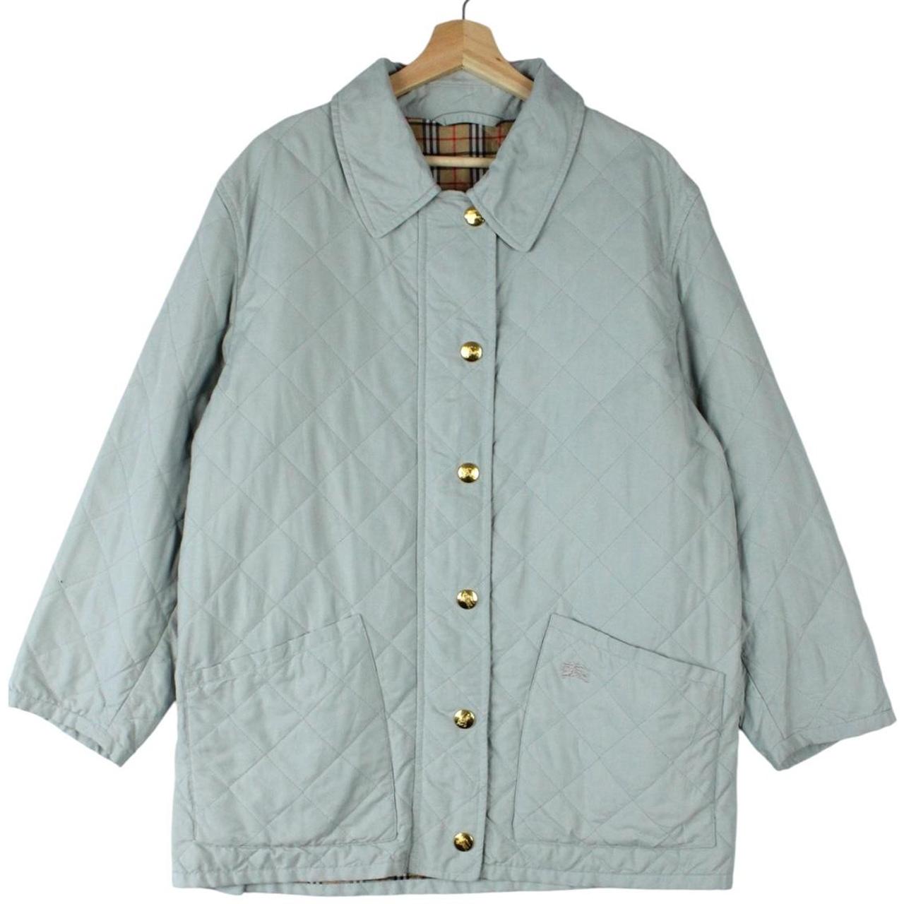 Burberry light blue diamond quilted jacket with Nova Check pattern and logo detail.