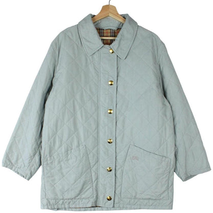 Burberry light blue diamond quilted jacket with Nova Check pattern and logo detail.
