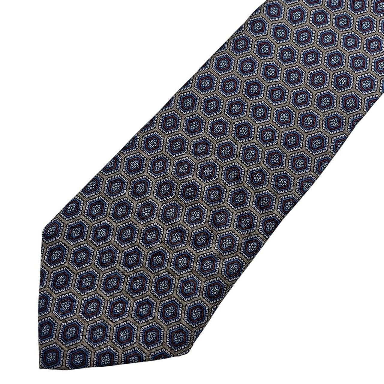 Aquascutum blue and grey silk tie with geometric print pattern.