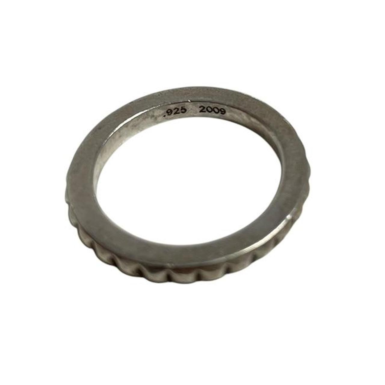 Chrome Hearts silver 3mm cross ring with engraved logo and minor scratches.