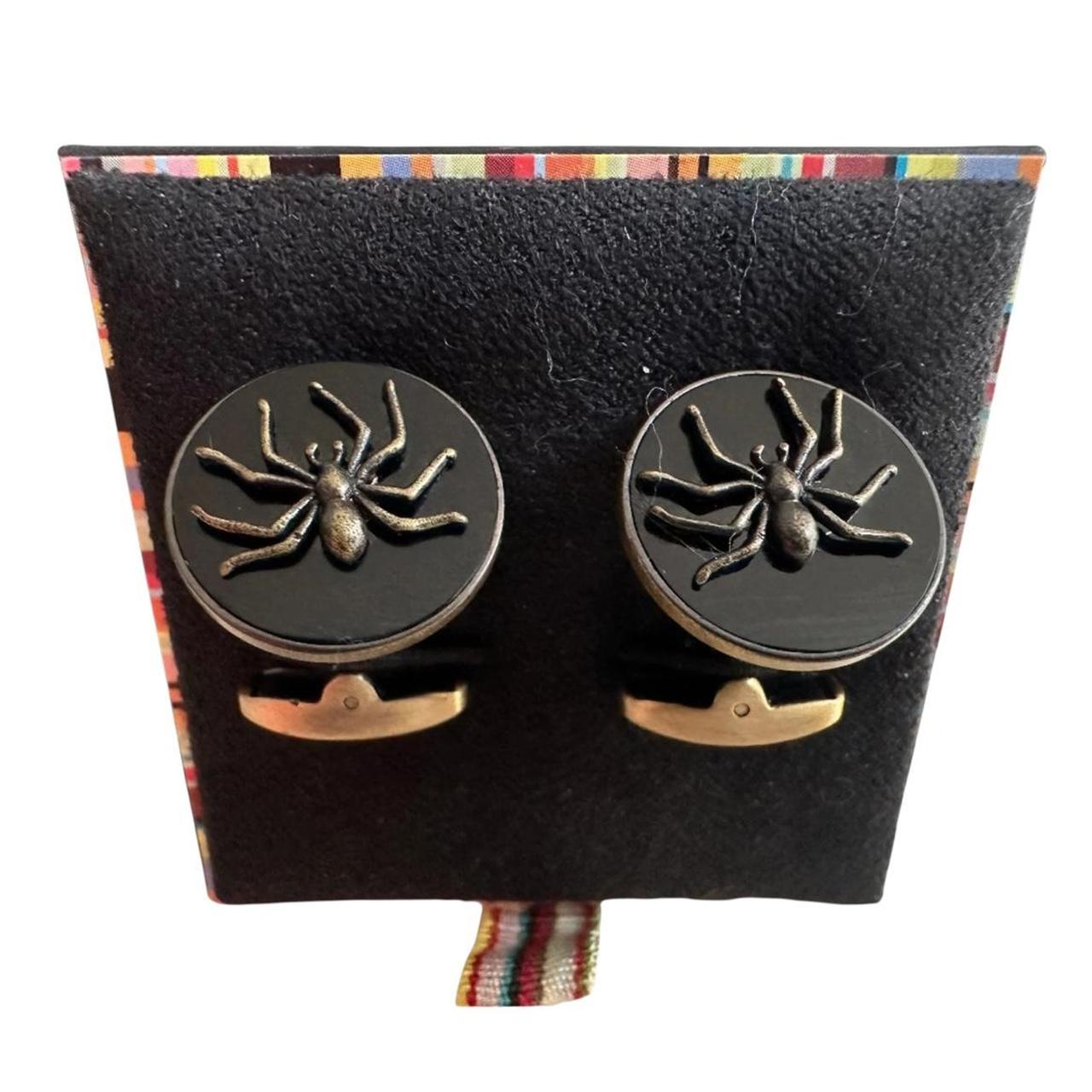 Paul Smith gunmetal cufflinks 2D spider design with intricate detailing and brand logo.