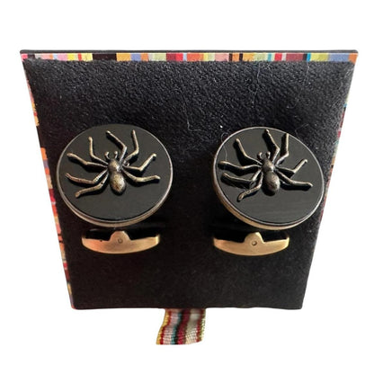 Paul Smith gunmetal cufflinks 2D spider design with intricate detailing and brand logo.