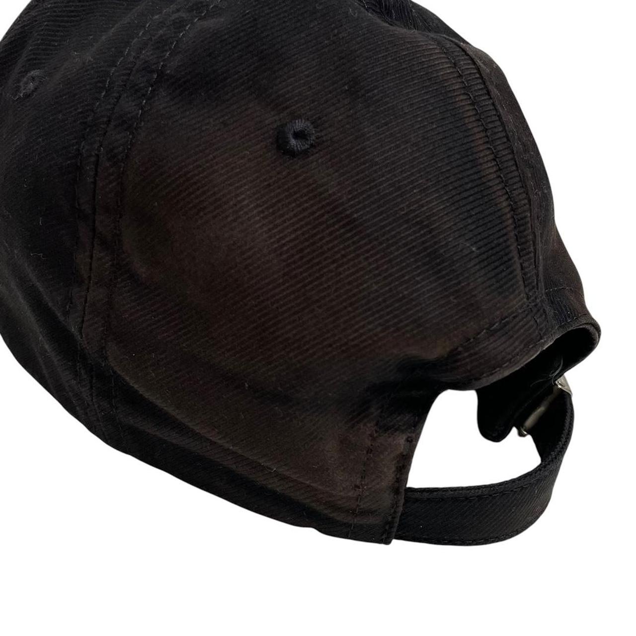 Burberry black baseball cap with red Horseferry logo embroidery and worn condition.