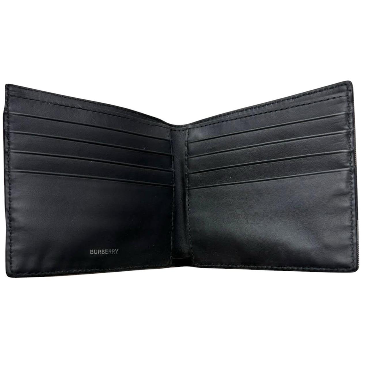Burberry navy blue bifold wallet featuring iconic Nova Check pattern and logo.
