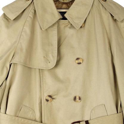 Burberry beige trench coat with Nova Check pattern, double breasted and belted design.