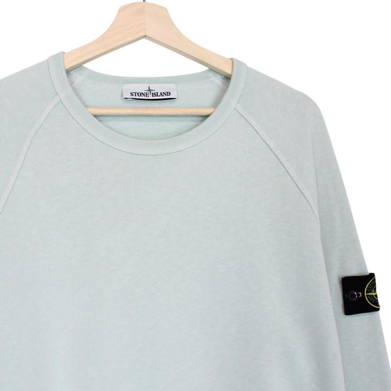 Stone Island mint green cotton sweatshirt with logo patch and ribbed cuffs.