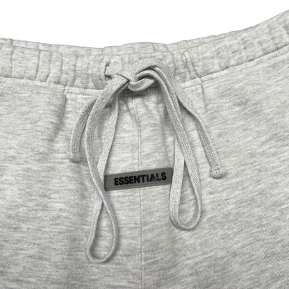 Essentials grey jogger shorts cotton material with logo detail and relaxed fit.