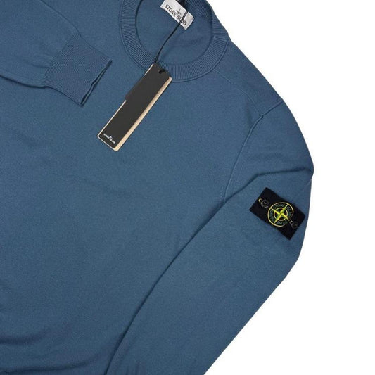 Stone Island blue organic cotton knit jumper with logo patch and ribbed cuffs.