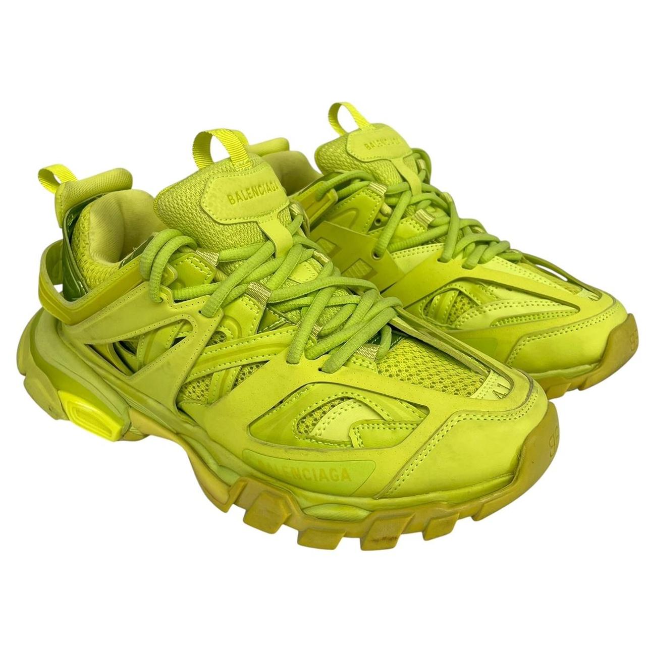 Balenciaga green low top trainers with logo detailing and textured mesh upper.