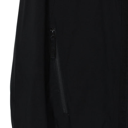 Stone Island black soft shell jacket with full zip and iconic compass logo.
