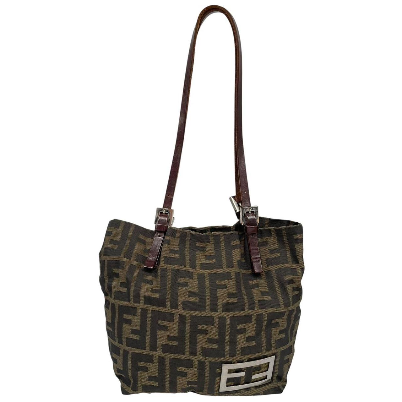 Fendi brown duffel bag featuring iconic Zucca monogram canvas and durable handles.