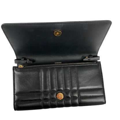 Burberry black and gold quilted leather small Lola shoulder bag with logo detail.