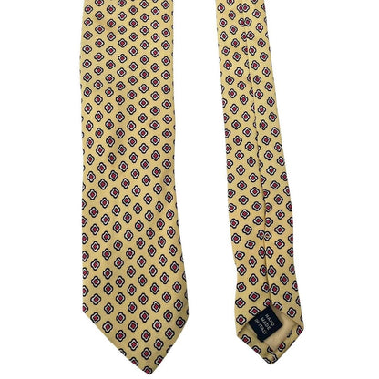 Polo Ralph Lauren yellow silk tie with geometric print design and logo detail.