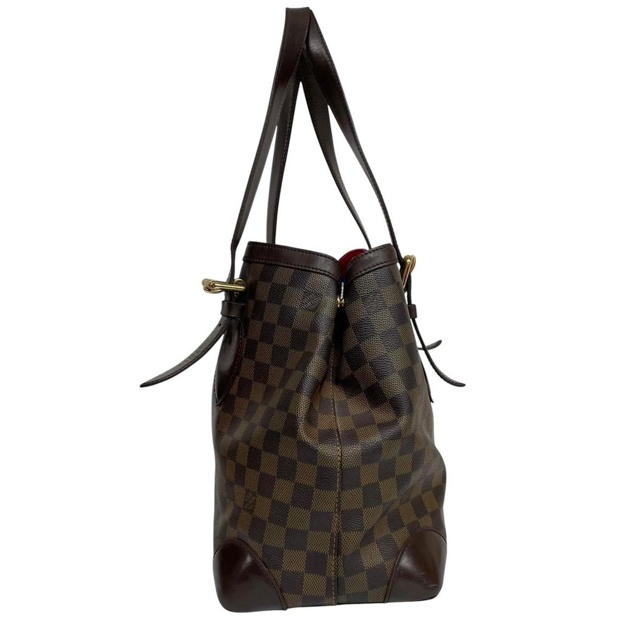 Louis Vuitton brown duffel bag with Damier Ebene pattern and logo plaque details.