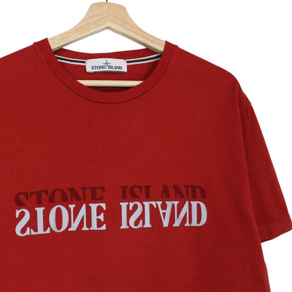 Stone Island red short sleeve t-shirt with reflective logo print and cotton material.