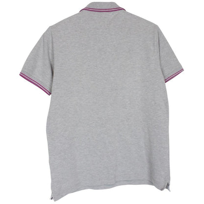 Stone Island grey polo shirt with embroidered compass logo and cotton material.