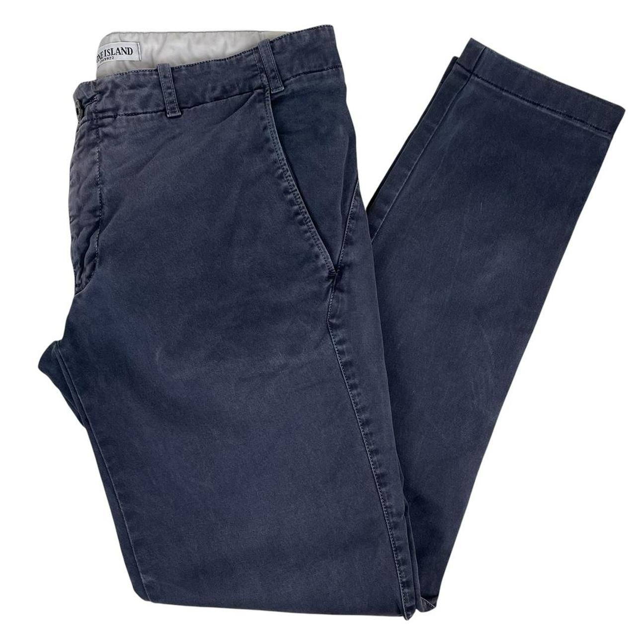Stone Island navy blue slim fit cotton trousers with logo patch and fading details.