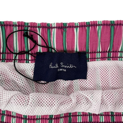 Paul Smith red swim shorts with striped pattern and cotton material.