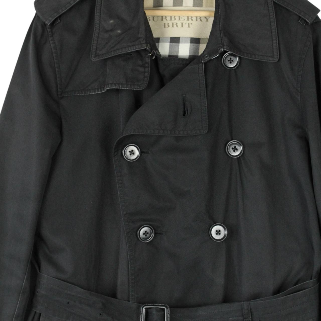 Burberry black trench coat featuring Nova Check pattern, double-breasted design, and belted waist.