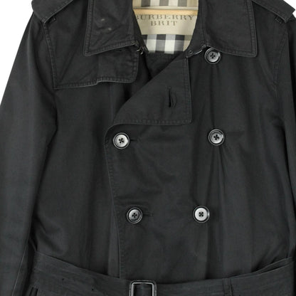 Burberry black trench coat featuring Nova Check pattern, double-breasted design, and belted waist.