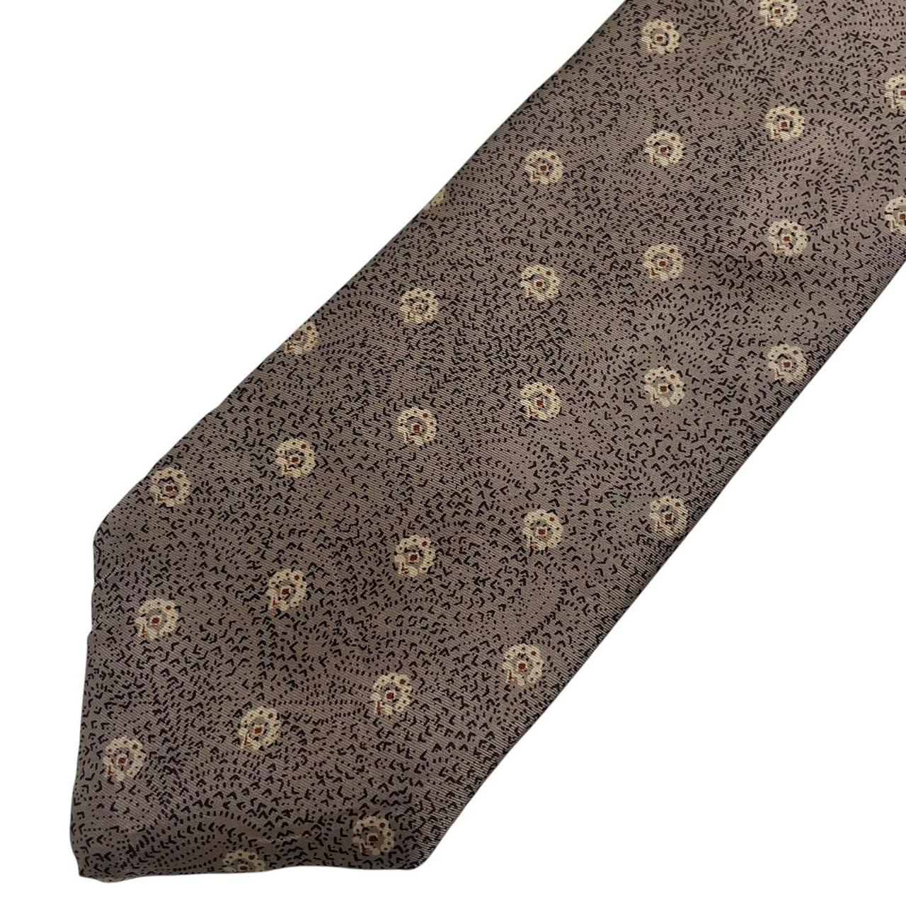 Christian Dior brown silk tie with subtle sheen and classic design elements.