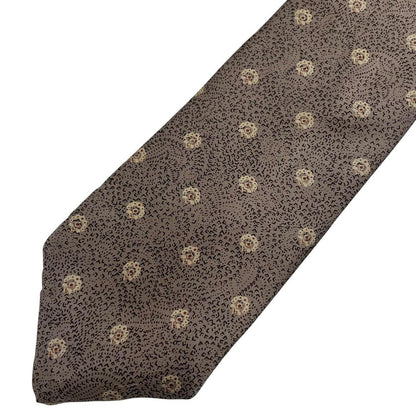 Christian Dior brown silk tie with subtle sheen and classic design elements.