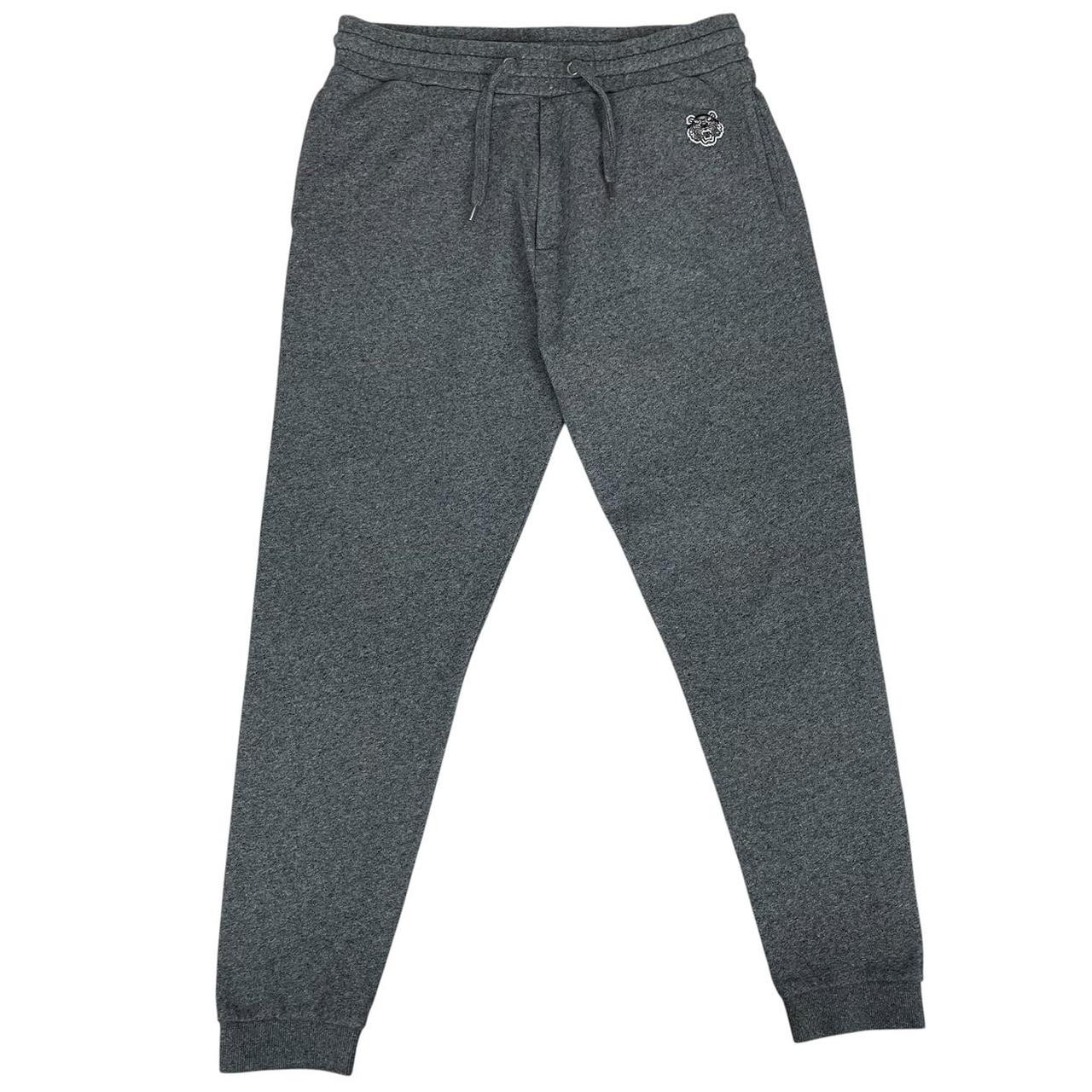 Kenzo grey joggers featuring embroidered tiger logo and soft cotton material.
