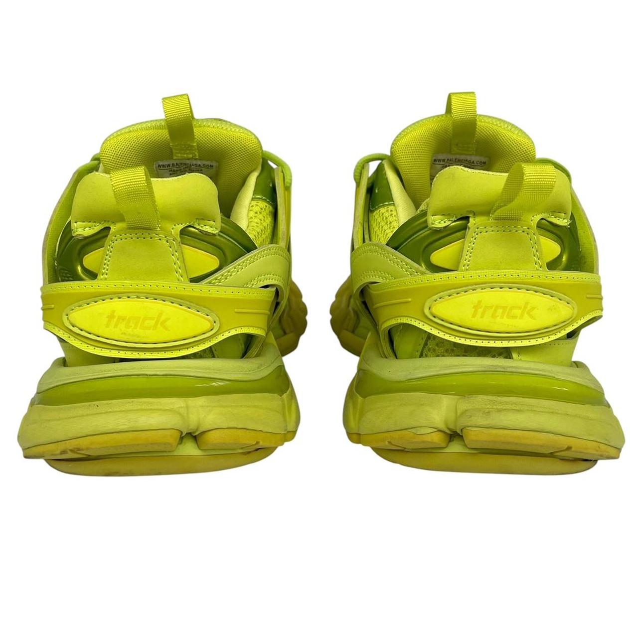 Balenciaga green low top trainers with logo detailing and textured mesh upper.