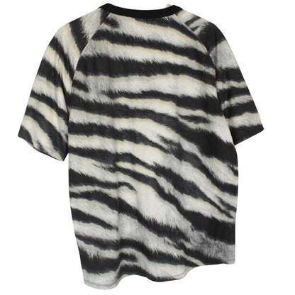 Stone Island short sleeve t-shirt in tiger camo pattern with logo patch on sleeve.