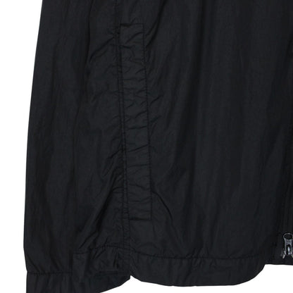 Stone Island black overshirt jacket with full zip, two zipped pockets, and snap button cuffs.