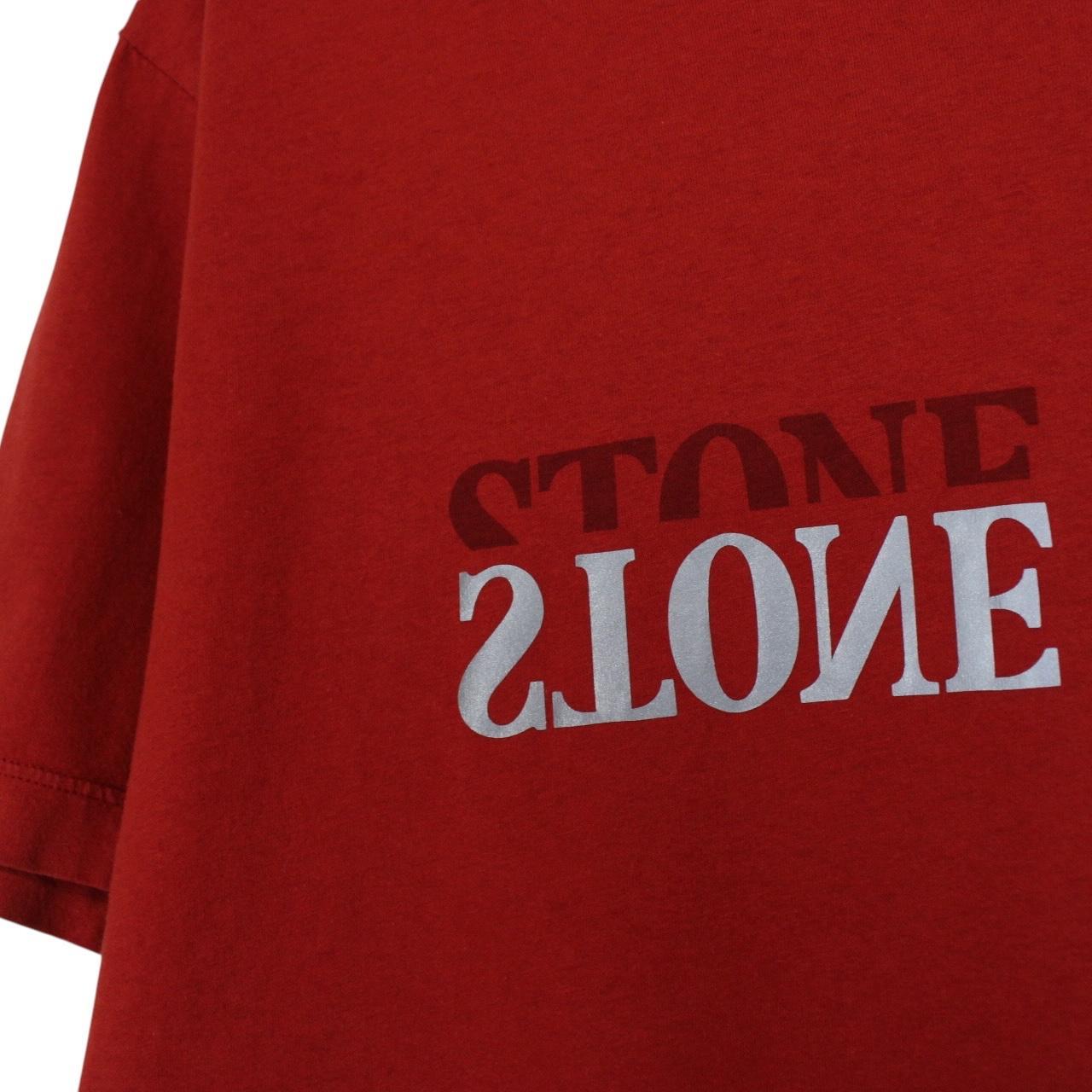 Stone Island red short sleeve t-shirt with reflective logo print and cotton material.