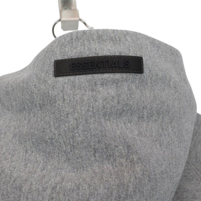 Essentials grey hoodie jumper with oversized fit and subtle logo detail.