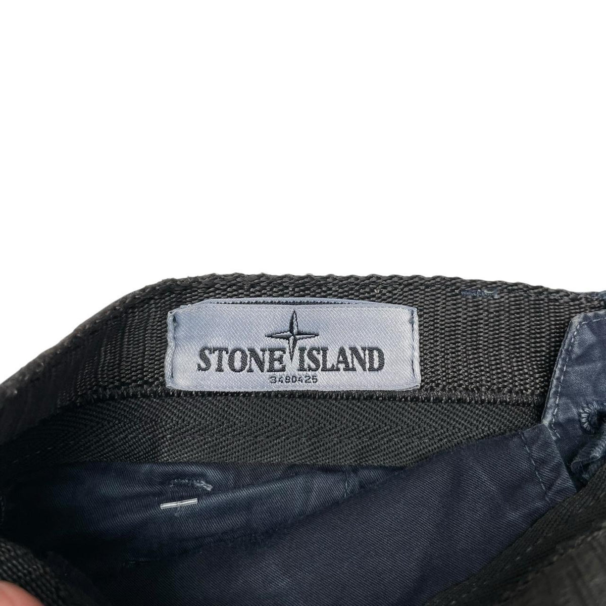 Stone Island navy blue cargo shorts with logo patch and cotton material.