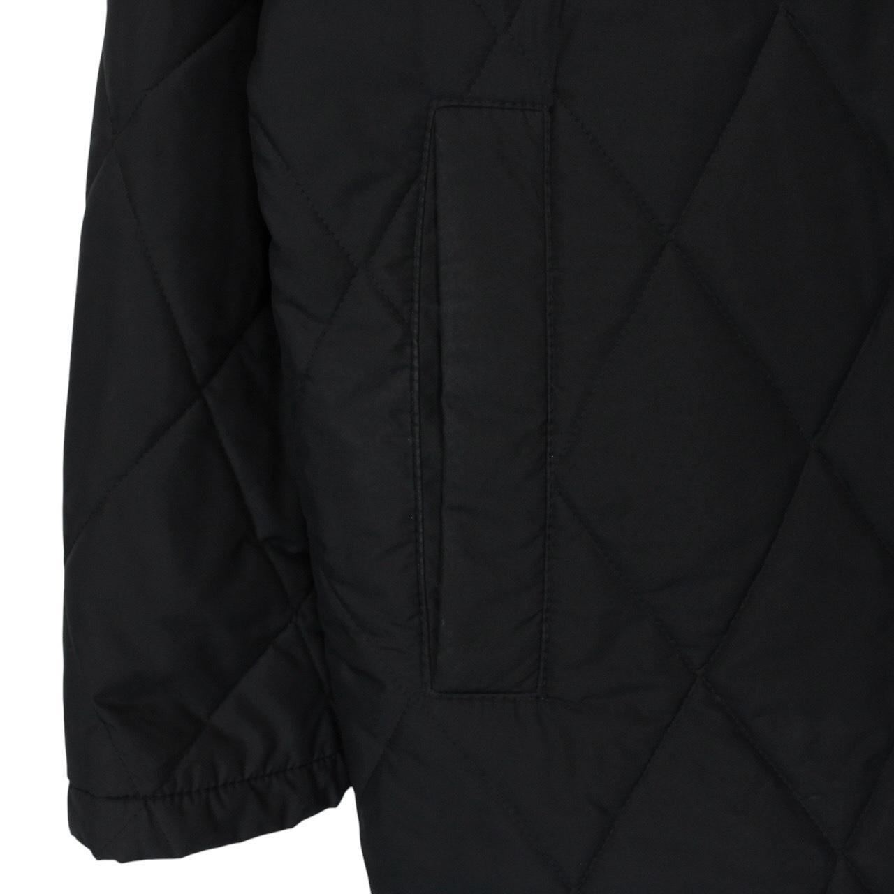 Burberry black coat with Nova Check lining and diamond quilted pattern.