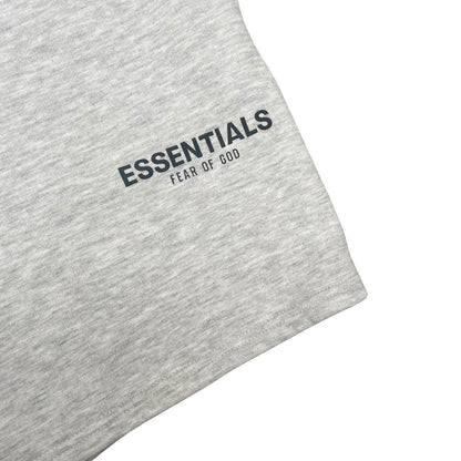 Essentials grey jogger shorts cotton material with logo detail and relaxed fit.