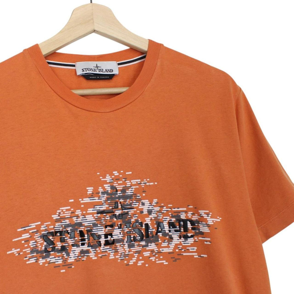 Stone Island orange short sleeve t-shirt with logo print and cotton material.