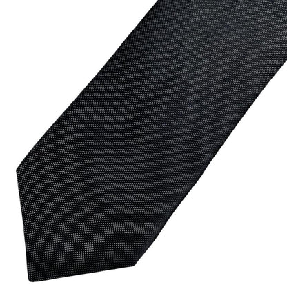 DKNY black silk tie with classic design and subtle sheen.